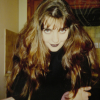 Portrait of Coralie wearing dark make-up, Halloween 1996