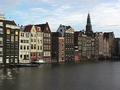 Row of buildings over Damrak river