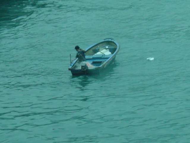 Fisher in a small boat