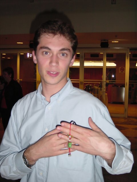 Olivier holding a monkey pendant