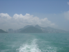 HK island in the fog from the distance of a ferry boat