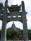 Buddah seen through the monastery stone gate