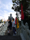 Daniel and Ian pausing on the stairs under the Tiantan Buddah