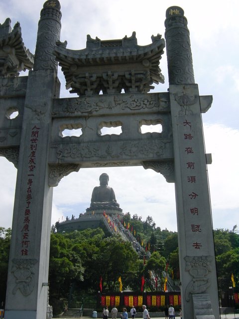 Buddah seen through the monastery stone gate