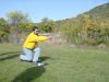 Simon throwing, a knee almost to the ground