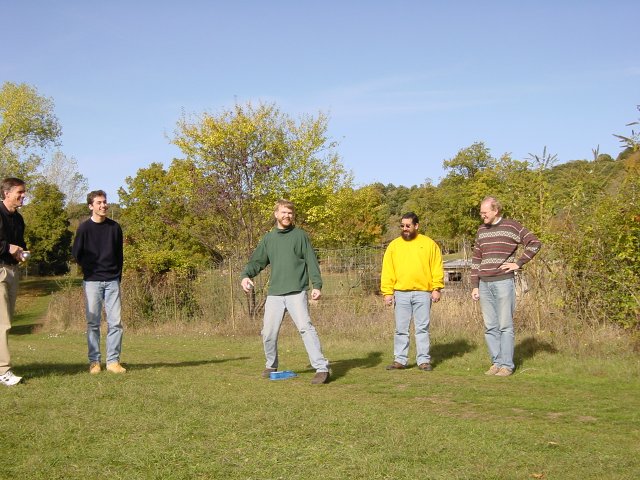 Ted about to throw the boule like a rock, Steve, Olivier, Simon and Bert laughing
