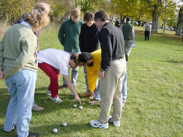Ian and Simon arguing while every one else watch the boules