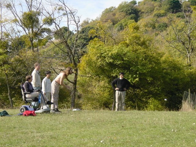 Chris throwing, his team watching