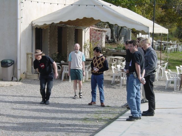 Charles about to throw, his team watching