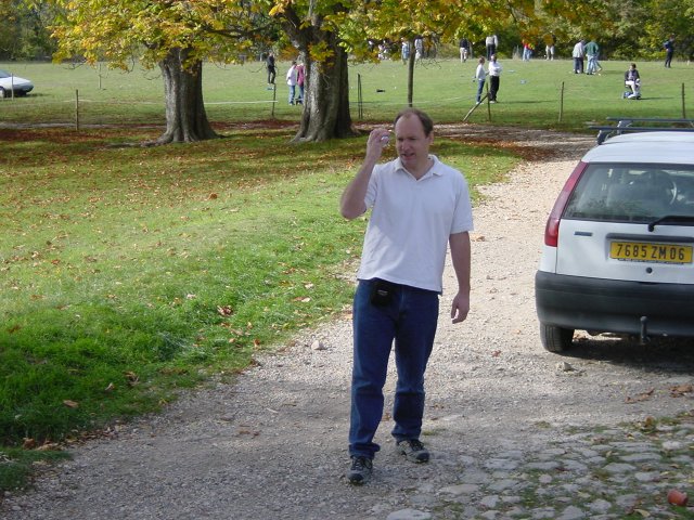 Tim frowning and holding his boule in front of his face
