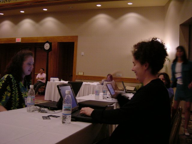 Susan and Amy at a desk in the rehearsal room