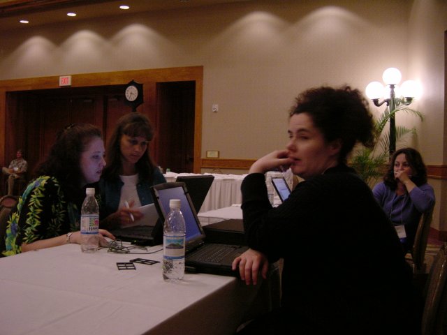 Susan, Caroline and Amy at a desk in the rehearsal room