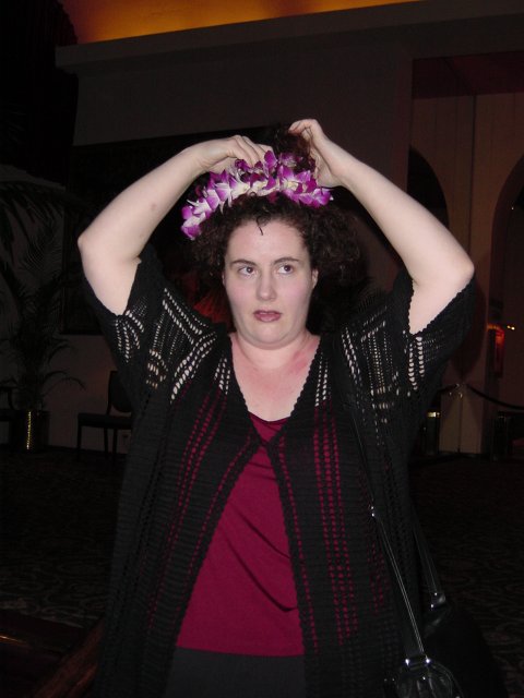 Amy afixing a lei on her head