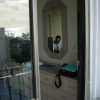 Reflection of Daniel in the mirror of our room