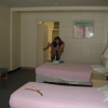 Our new room at the Hawaiiana Hotel, Caroline in the background