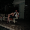 Daniel playing his Ukulele by the pool