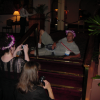 Amy and Caroline taking picture of Dean pausing on the floor
