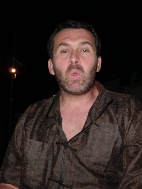 Daniel singing, his mouth forming a zero