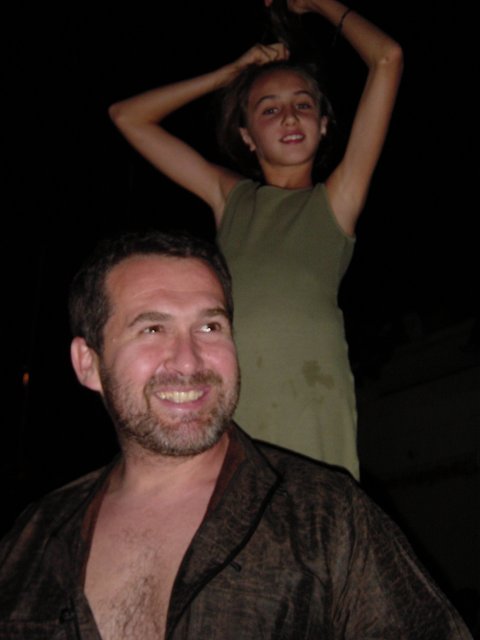 Daniel smiling and Alice standing behind