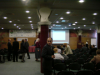 Ravel room with columns and screen behind