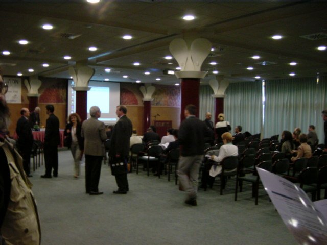 Ravel room with columns and screen behind
