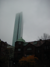 High building with top in the fog
