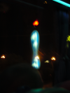 Double reflection of a street sign in the bus window