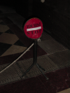 "tourist stop" red sign with ropes