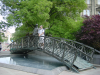 Dean mimicking the bronze man standing on the bridge