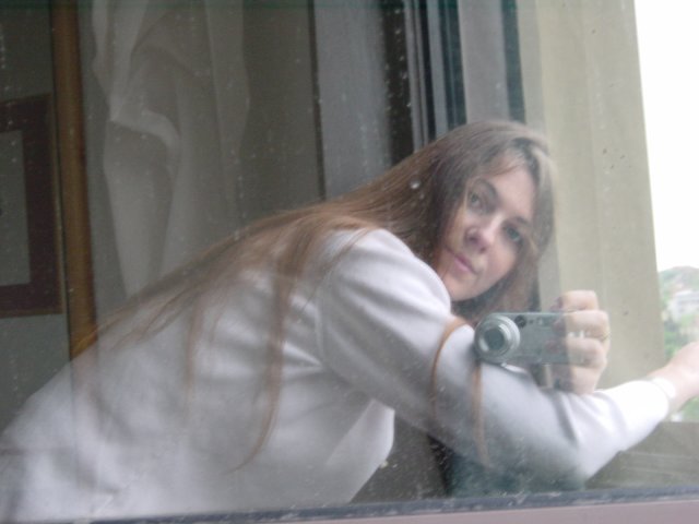 Selfportrait in the window pane