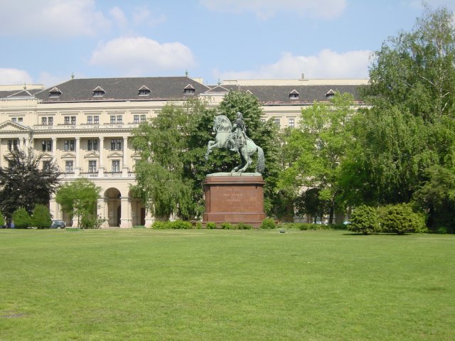 Statue of a man riding a horse in a park