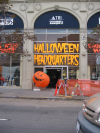 Shop window reading "Halloween Headquarters" in large orange letters