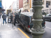 Van being towed away and police officer placing a ticket