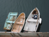 Three rowing boats (note two sea lions nested in one)