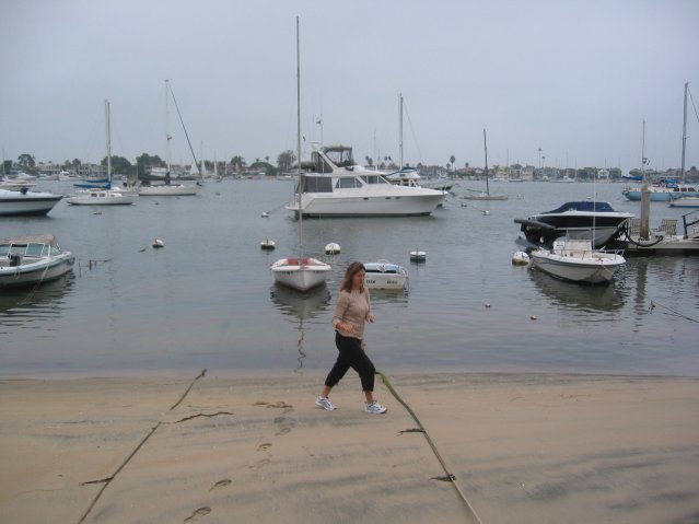 Alexandra walking on the beach, hunting shells