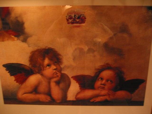 Raphael's angels looking up toward a hamburger