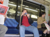 Yves in the train holding his camera