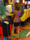 Nicely dressed girl looking at this friends slaying bad guys