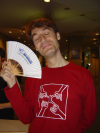 Karl holding the W3C goodie fan and closing his eyes