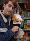 Karl holding cream containers in the forms of breasts and buttocks