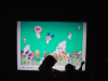 Roppongi Hills illuminated poster and children touching it