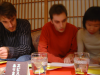 Karl, Olivier and Yoko looking at the menu