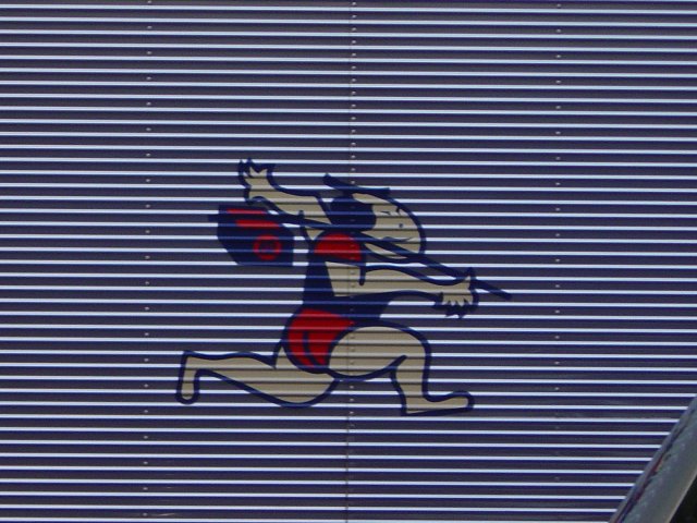 Drawing of a Japanese man running (from the side of a truck)