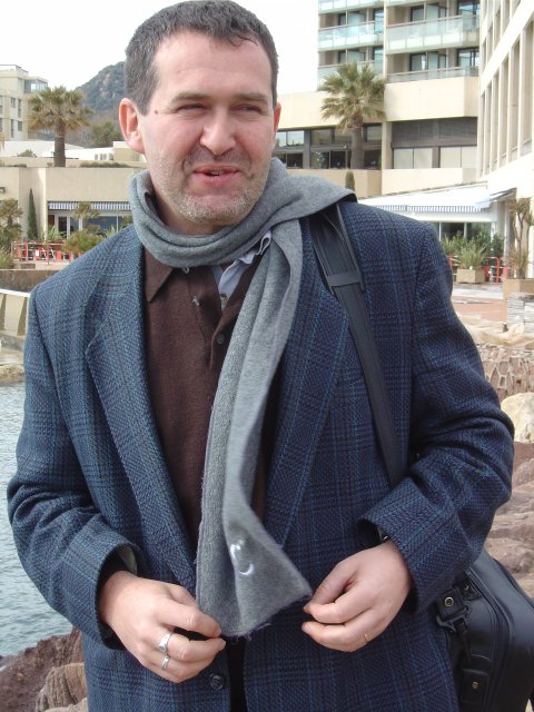 Daniel in front of the hotel, on the dam