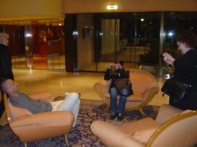 Amy and Alex both taking a picture of Dean