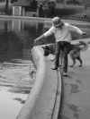Woman bathing her dog