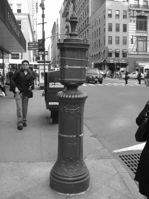 NYFD red olf fire hydrant on the pavement