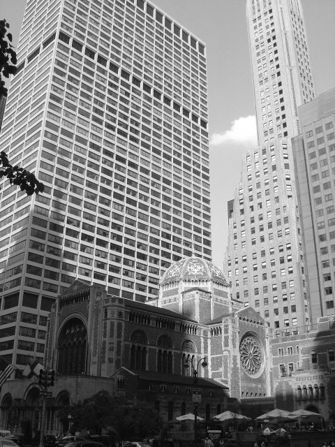 St Bart church nested amond tall buildings
