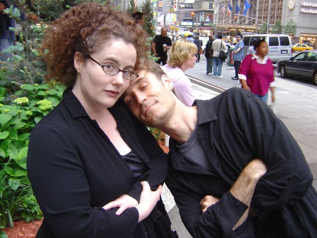 Karl resting his head on Amy's shoulder