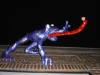 The Blue Frog sticking out giant red tongue